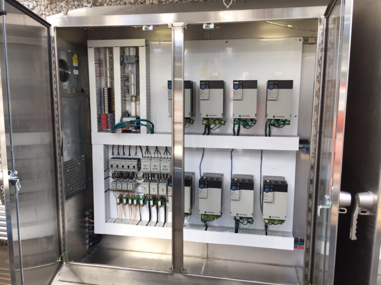 Custom industrial control panel with Allen-Bradley drives, wiring, relays, and automation components for gas processing systems.